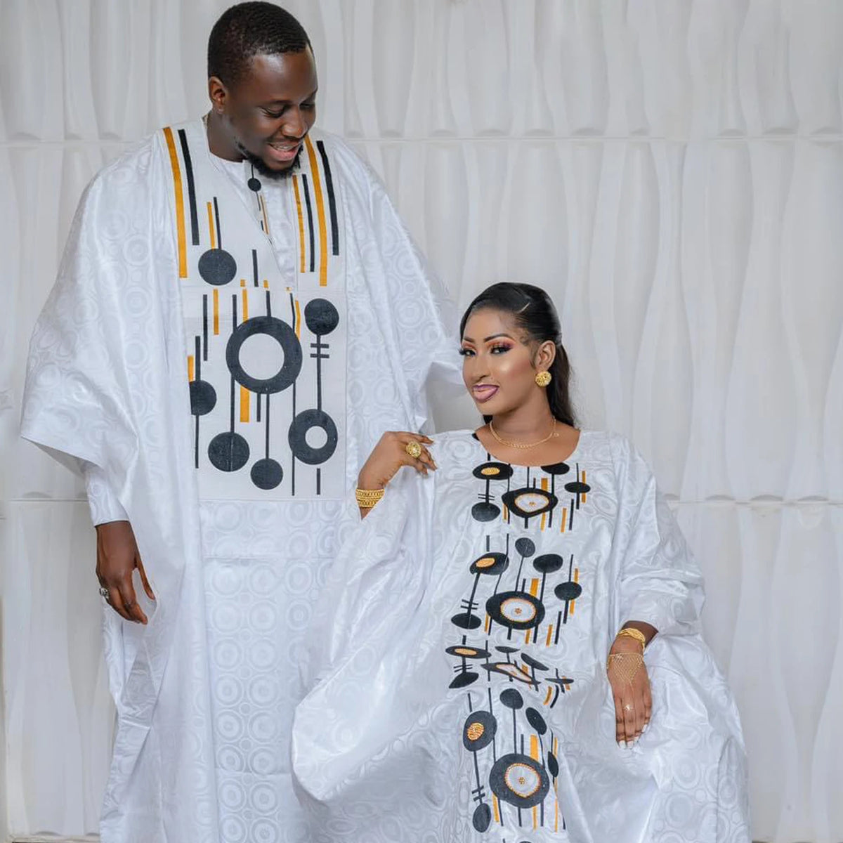 Step into timeless African luxury with our Bazin Riche Embroidery Couple Design Dress — a floor-length masterpiece