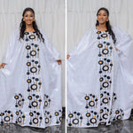 Step into timeless African luxury with our Bazin Riche Embroidery Couple Design Dress — a floor-length masterpiece