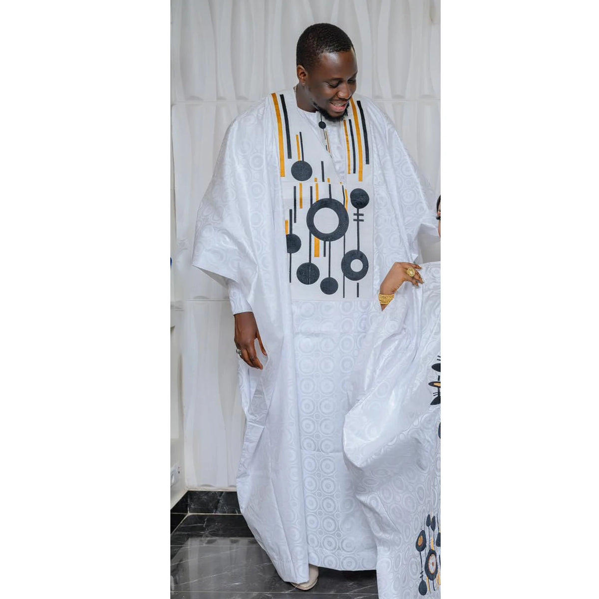 Step into timeless African luxury with our Bazin Riche Embroidery Couple Design Dress — a floor-length masterpiece