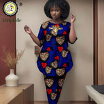 Woman wearing a colorful outfit with heart patterns in a room setting, featuring the Afripride brand.