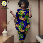 Woman wearing a colorful traditional outfit with Afripride logo in the corner.