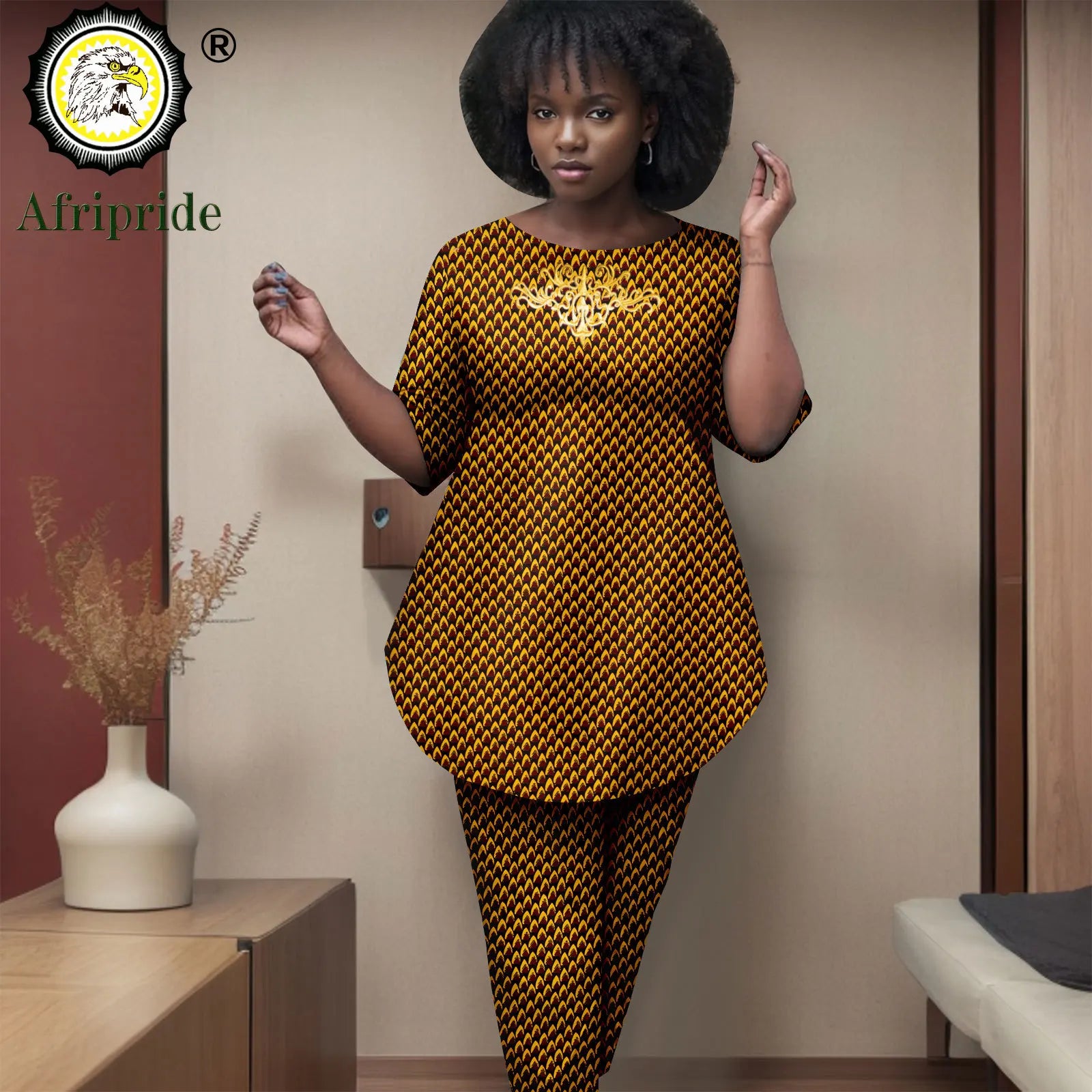 Woman wearing a yellow and black patterned outfit with 'Afripride' branding.