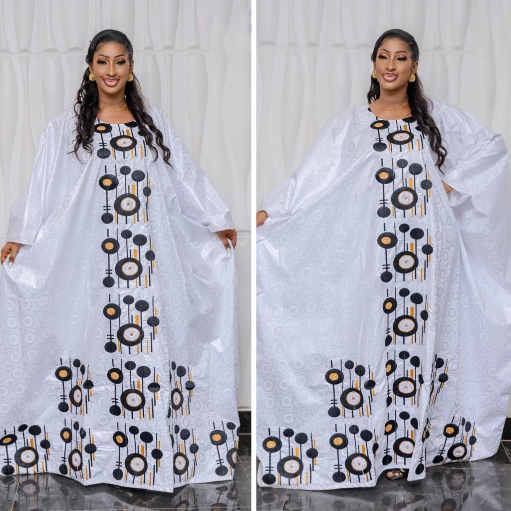 Step into timeless African luxury with our Bazin Riche Embroidery Couple Design Dress — a floor-length masterpiece