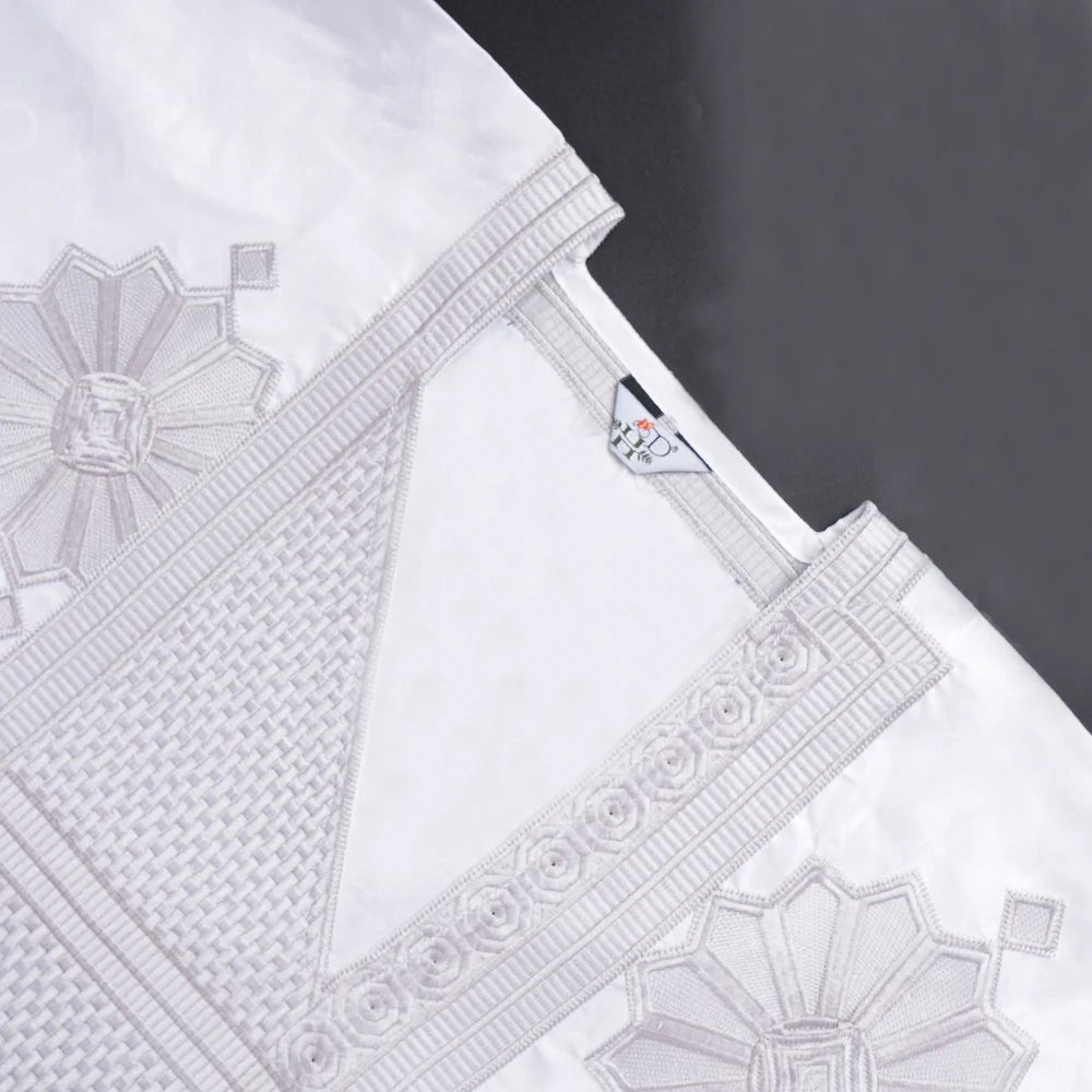 Step into timeless elegance with this African Men’s White 3PC Bazin Riche Outfit, a refined traditional clothing set designed