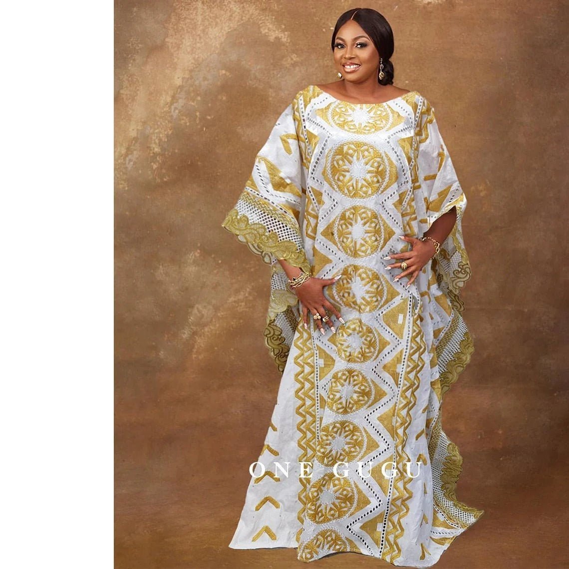 Radiate Elegance in our Nigerian Bazin Dress - Gold Brocade Embroidery and White Robe Design Perfect for Weddings & Parties - Flexi Africa - Free Delivery Worldwide only at www.flexiafrica.com