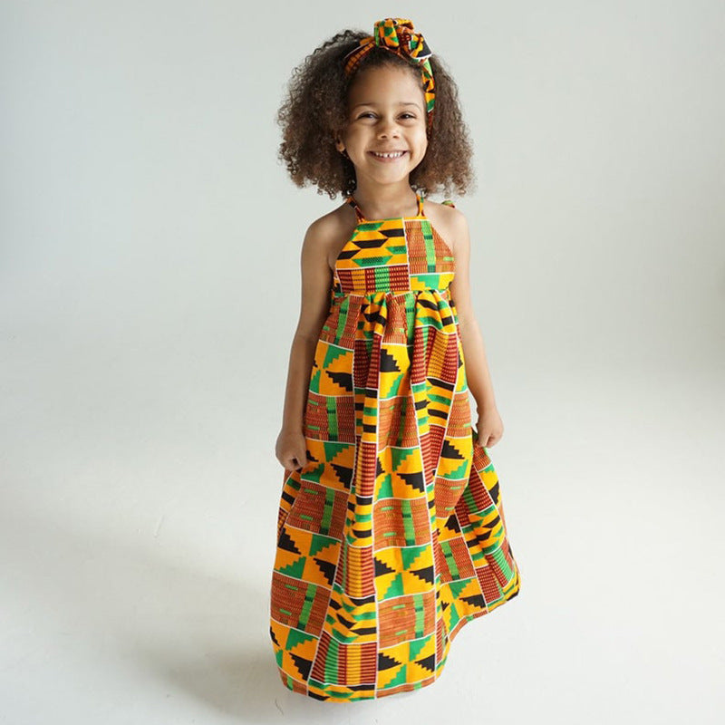 Sunshine Princess: Traditional African Kanga Print Party Dress for Girls - Flexi Africa - Flexi Africa offers Free Delivery Worldwide - Vibrant African traditional clothing showcasing bold prints and intricate designs